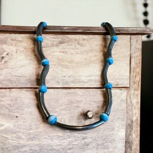 Unusual vintage silver tone tubes with cat’s eye stone or glass beads